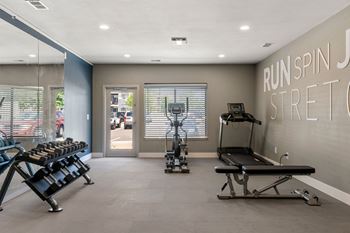 Fitness center with various gym equipment at horizon east.